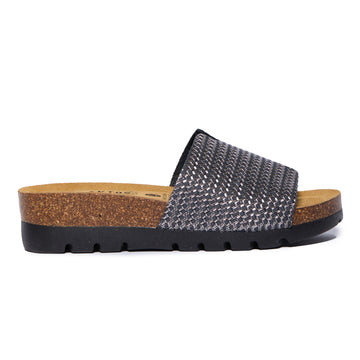 A pair of women's sandals with a metallic nickel color and a EVA sole, handmade in Spain.